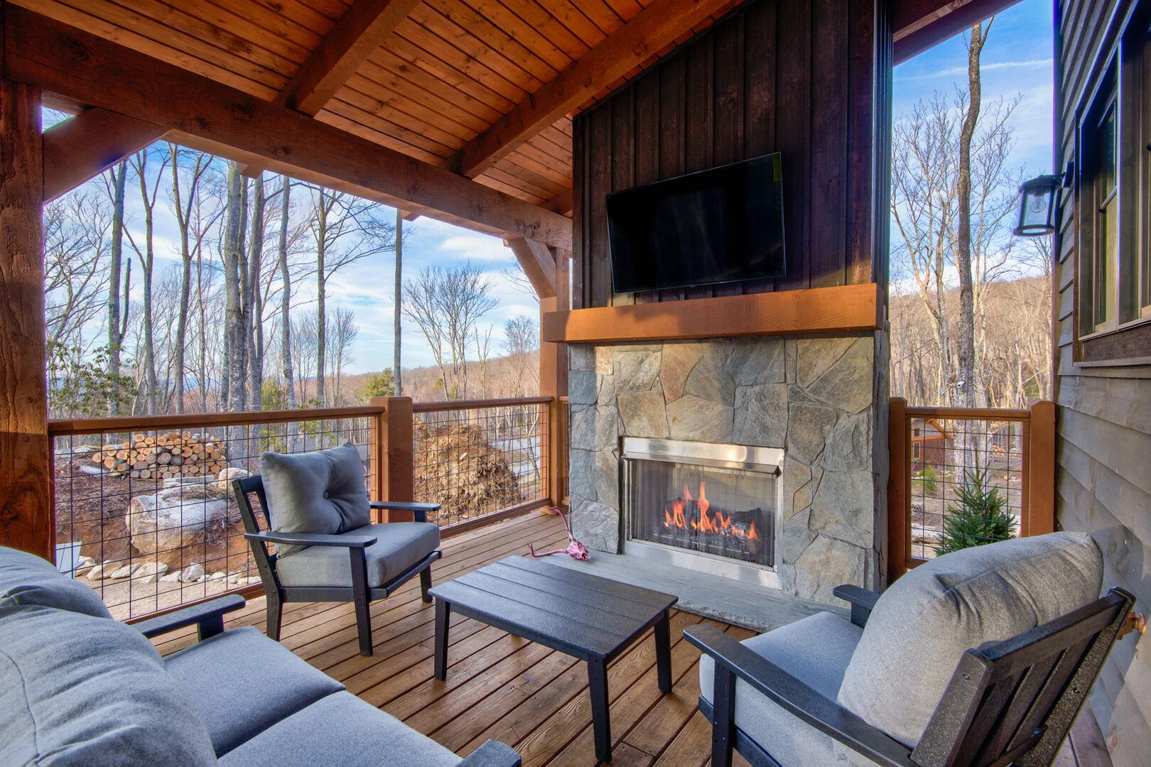 Covered outdoor deck with fireplace
